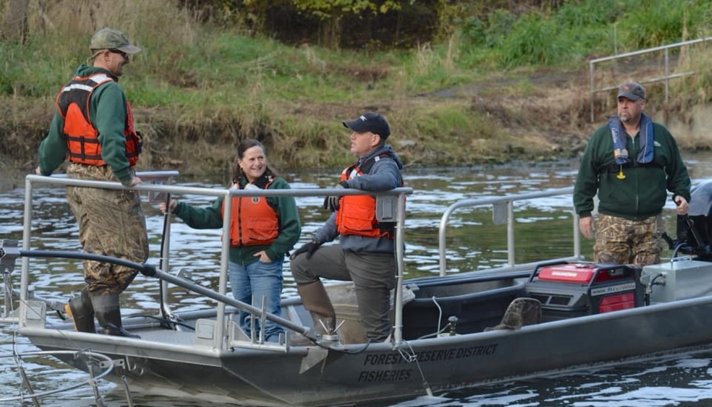 Staff pictured on a fishing boat outdoors.